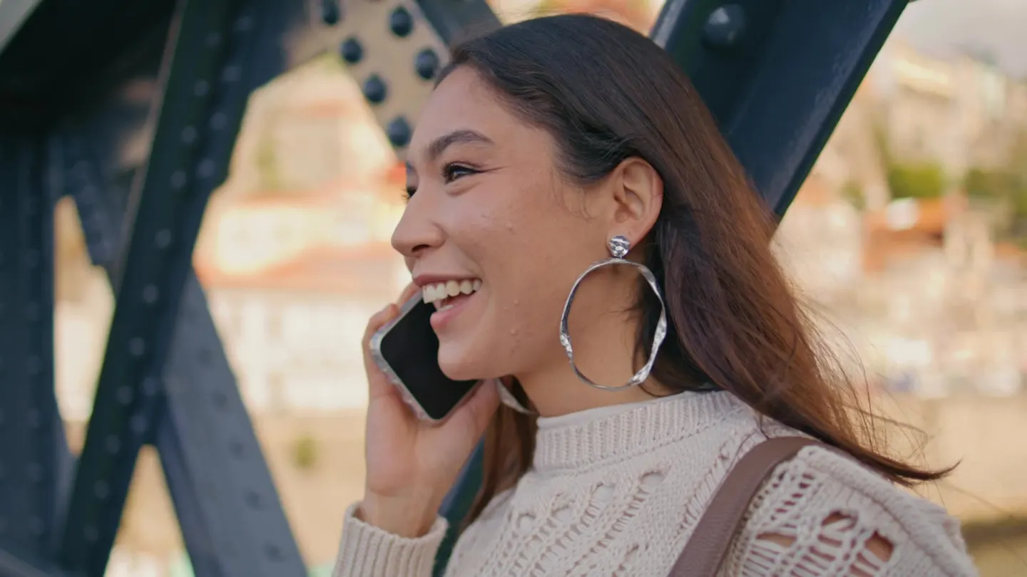 Woman talking on the phone outdoors